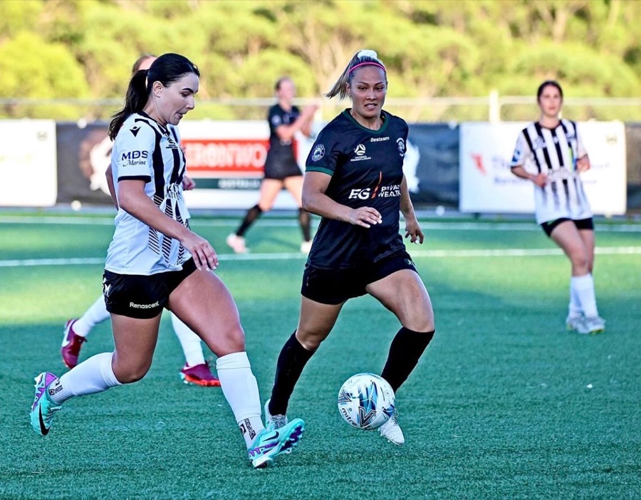 Jessie playing premier division football, on the ball.